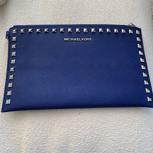 Michael Kors blue leather with silver spikes wrist clutch
